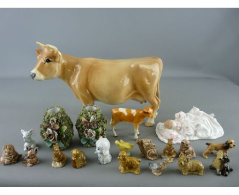 Royal Doulton figurine 'New Baby' HN3712, a Melba ware cow, a Beswick calf and a quantity of Wade Whimsies etc