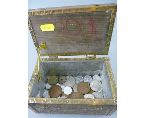 Repousse brass tea caddy containing a quantity of British and overseas vintage coinage