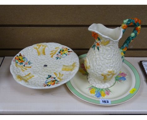 Clarice Cliff Newport Pottery jug and pedestal plate set and a Clarice Cliff Newport Pottery 'Crocus' plate