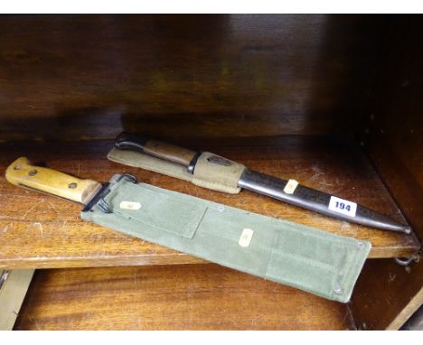 Military bayonet with scabbard and a military long bladed knife