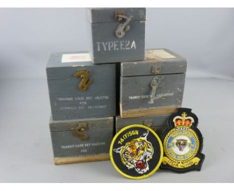 Five vintage wooden transit cases for compass instruments and two RAF 74th Squadron embroidered badges