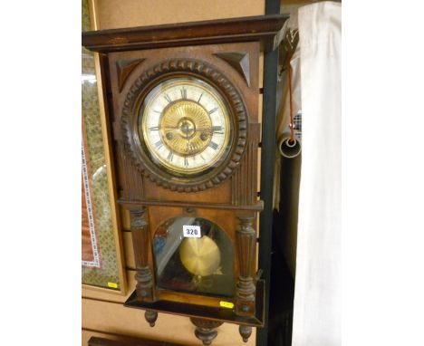 Vintage Continental pendulum wall clock, the enamel dial set with Roman numerals