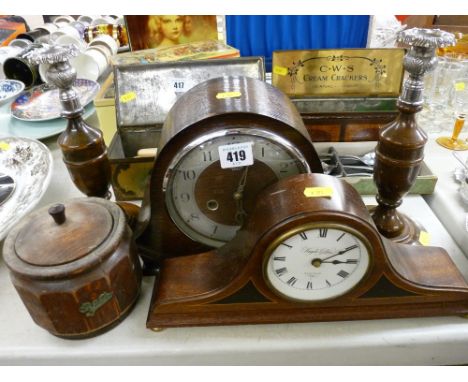 Two vintage mantel clocks, a pair of oak and chrome candlesticks with a similar tea jar and cover
