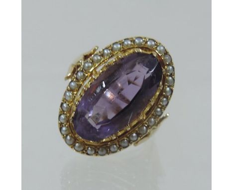 An 18 carat gold amethyst and seed pearl dress ring