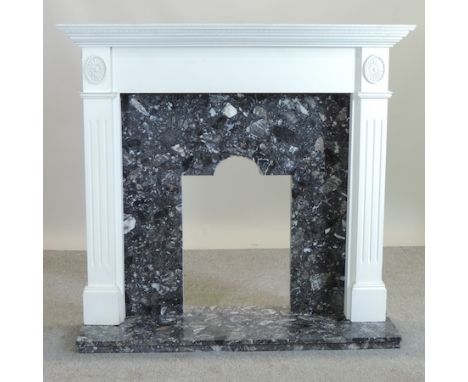 A contemporary marble and white painted fire surround, 130cm, with grate