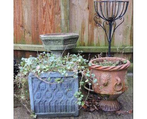 A reconstituted stone bird bath, 60cm tall, together with a collection of garden pots, to include a black painted planter