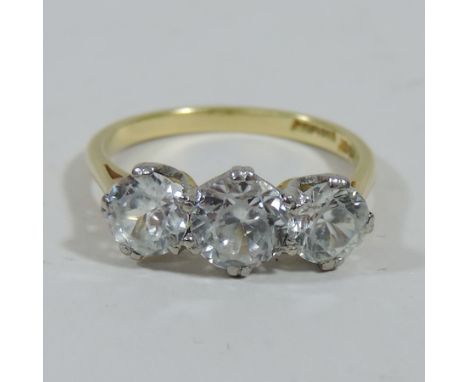 An 18 carat gold three stone gem set ring