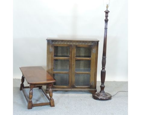 An old charm oak glazed bookcase, 92cm, together with an oak coffee table and standard lamp