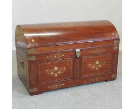 An Indian teak and brass inlaid dome top trunk, 91cm