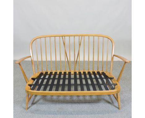 A light elm Ercol sofa, 130cm