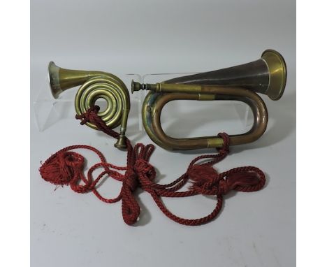 A copper and brass bugle, by Hawkes and Son, Piccadilly Circus, together with a small brass horn
