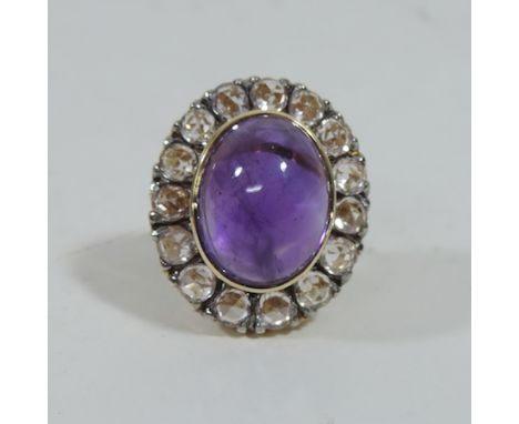 A 14 carat gold amethyst and gem set ring