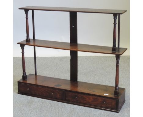 An 18th century oak graduated three tier wall shelf, 71cm 