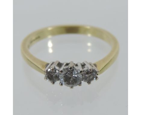 An 18 carat gold three stone diamond ring