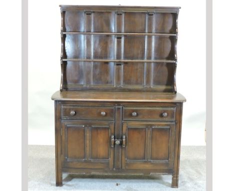 An Ercol dark elm dresser, 119cm