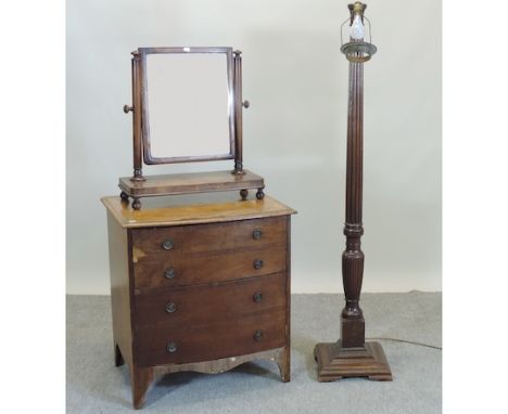 A George III mahogany bow front chest, 69cm, together with a mahogany standard lamp and a swing frame toiletry mirror