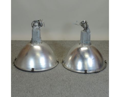 A pair of large industrial light fittings, 59cm diameter