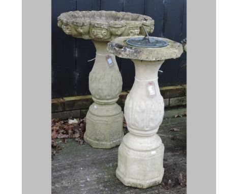 A reconstituted stone bird bath, 72cm tall, together with a matching sundial