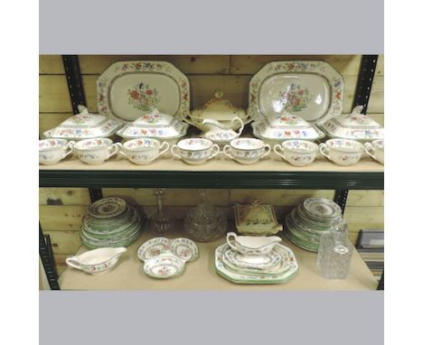 Two shelves of Copeland Spode Chinese Rose pattern part dinner service, together with a collection of decanters