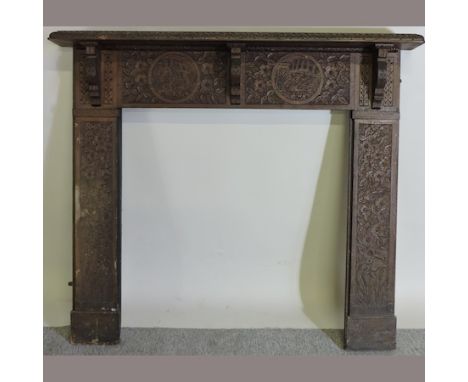 A 19th century carved oak fire surround, 140cm
