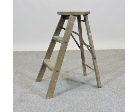 An early 20th century folding wooden step stool, by Globe Wernicke