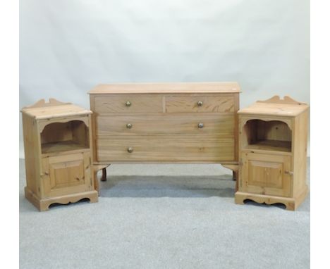 A 1920's light oak chest of drawers 107cm, together with a pair of modern pine bedside cabinets