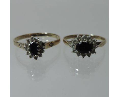 A 9 carat gold sapphire and diamond cluster ring, together with another similar