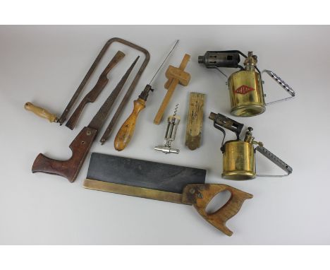 A collection of tools including saws and measures