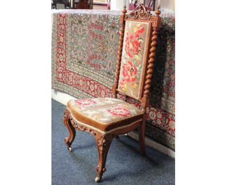 A Victorian nursing chair with spiral supports, tapestry seat, on cabriole legs