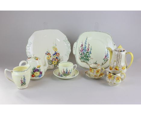 A Crown Staffordshire porcelain part tea service, together with three other part tea sets, all with cream ground and floral d