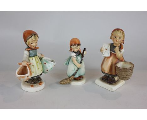 Three Goebel Hummel figures of girls performing household tasks (one a/f), tallest 15.5cm