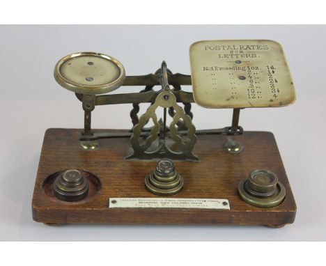 A set of postal scales and weights (some weights missing)