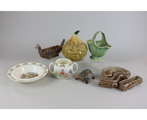 Six pieces of Wade porcelain including a Viking ship and a trinket box modelled as a tortoise, together with two pieces of Bu
