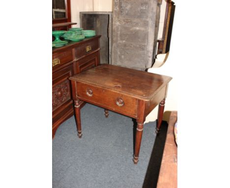 A Victorian oak side table with one long drawer, on turned legs, 84cm