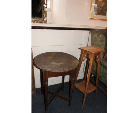 A circular dark oak side table on square support, on turned tapered legs on pad feet, 59cm, together with a light oak jardini