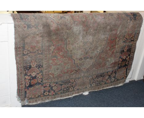 A Persian carpet with all-over pattern in red, blue and cream (a/f), 134cm by 200cm