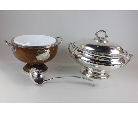 A silver plated oval tureen and cover with reeded handles, a silver plated soup ladle and a silver plate mounted wooden bowl 