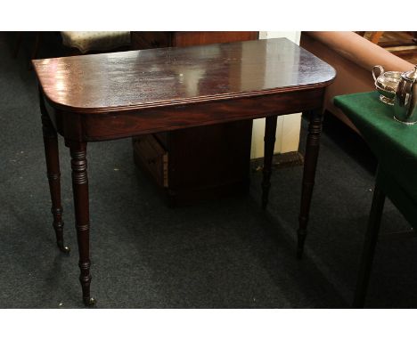 A George IV mahogany side table, ebony inlay, on turned legs with castors, 90cm wide, (converted from tea table)