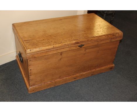 A pine trunk with two ring handles on plinth base, 90cm
