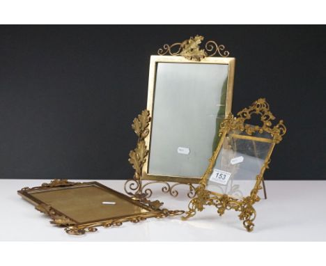 Pair of gilt metal picture frames with cast acorn &amp; leaf decoration, 33cm high, together with a Rococo-style cast brass e
