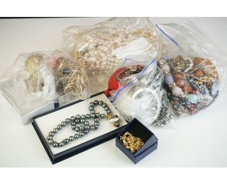 A mixed collection of vintage and contemporary costume jewellery to include pearls. 
