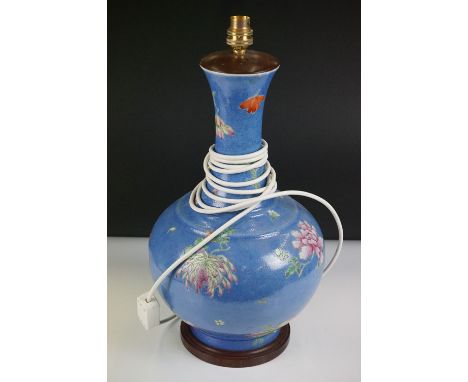 Chinese style Ceramic Bottle-shaped Table Lamp decorated in enamels with flowers on a blue ground, 48cm high with fittings 