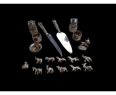 Silver handled cake slice and knife, 800 silver figure of a deer and an 800 silver salt, together with eleven silver plated a