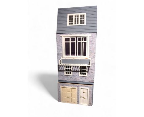 1:12 scale wooden four-storey dolls house with glazed shop front, with brick effect exterior and cream stucco finish under wo