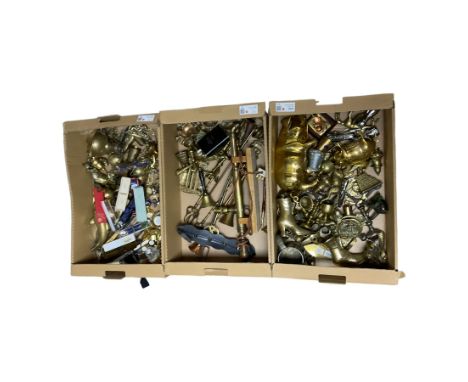 Large collection of metal ware, including piggy banks, walking stick handles, horns, miniature clocks etc, in three boxes   