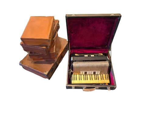 Collection of leather cases and a Contessa IV M accordion 