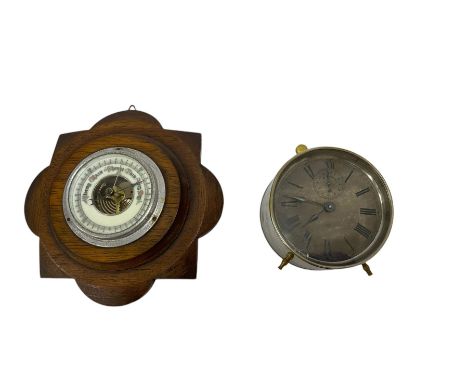 19th century American alarm clock and a 20th century wall hanging aneroid barometer