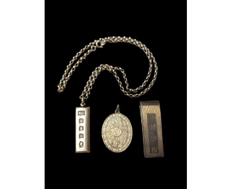 Silver money clip, silver ingot and a silver pendant, all hallmarked Condition Report:Approx 67 grams