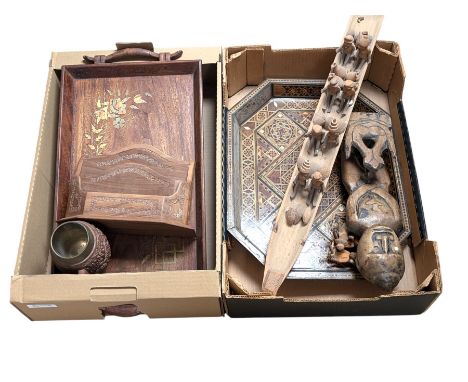 Carved Kashmir hardwood tankard, two inlaid trays, carved tribal boat and figure, etc