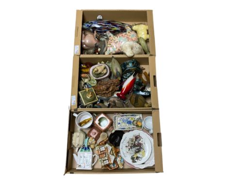 Collection of wooden ducks, together with novelty teapots, ceramic pigs, glass fish etc, in three boxes 